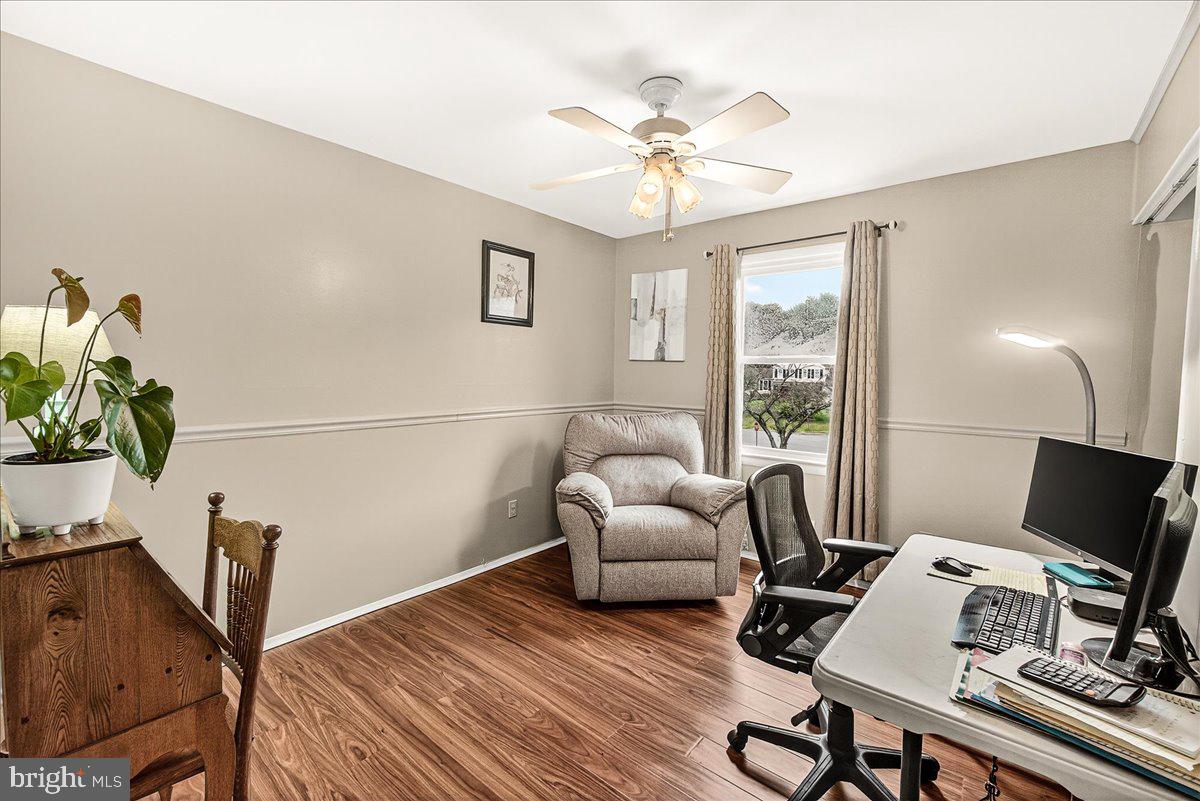 19624 Westerly Avenue Poolesville, MD 20837 - Photo 28 of 44 a view of a workspace with furniture and a window