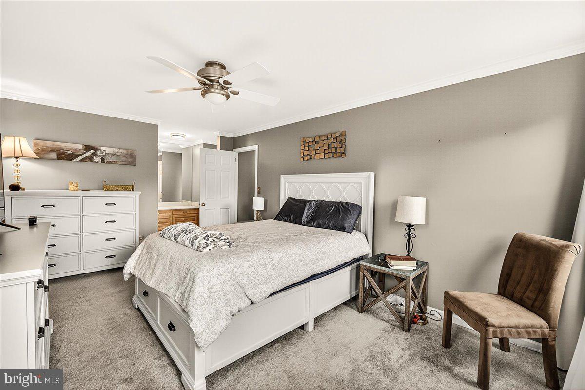 19624 Westerly Avenue Poolesville, MD 20837 - Photo 29 of 44 a bedroom with a bed and lamp