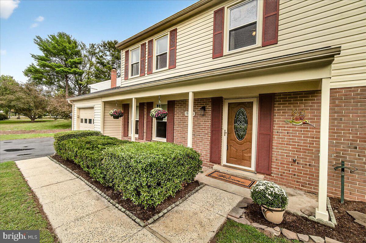 19624 Westerly Avenue Poolesville, MD 20837 - Photo 3 of 44 a front view of a house with garden