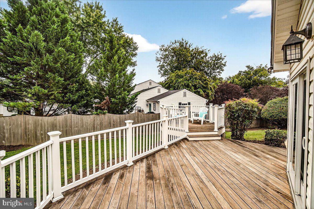 19624 Westerly Avenue Poolesville, MD 20837 - Photo 34 of 44 a view of a house with a small yard and wooden fence