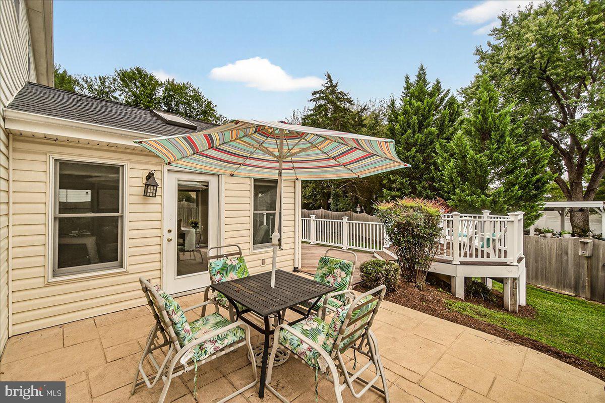 19624 Westerly Avenue Poolesville, MD 20837 - Photo 35 of 44 a balcony with table and chairs