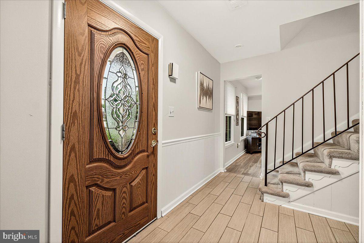 19624 Westerly Avenue Poolesville, MD 20837 - Photo 4 of 44 a view of a entryway door with wooden floor