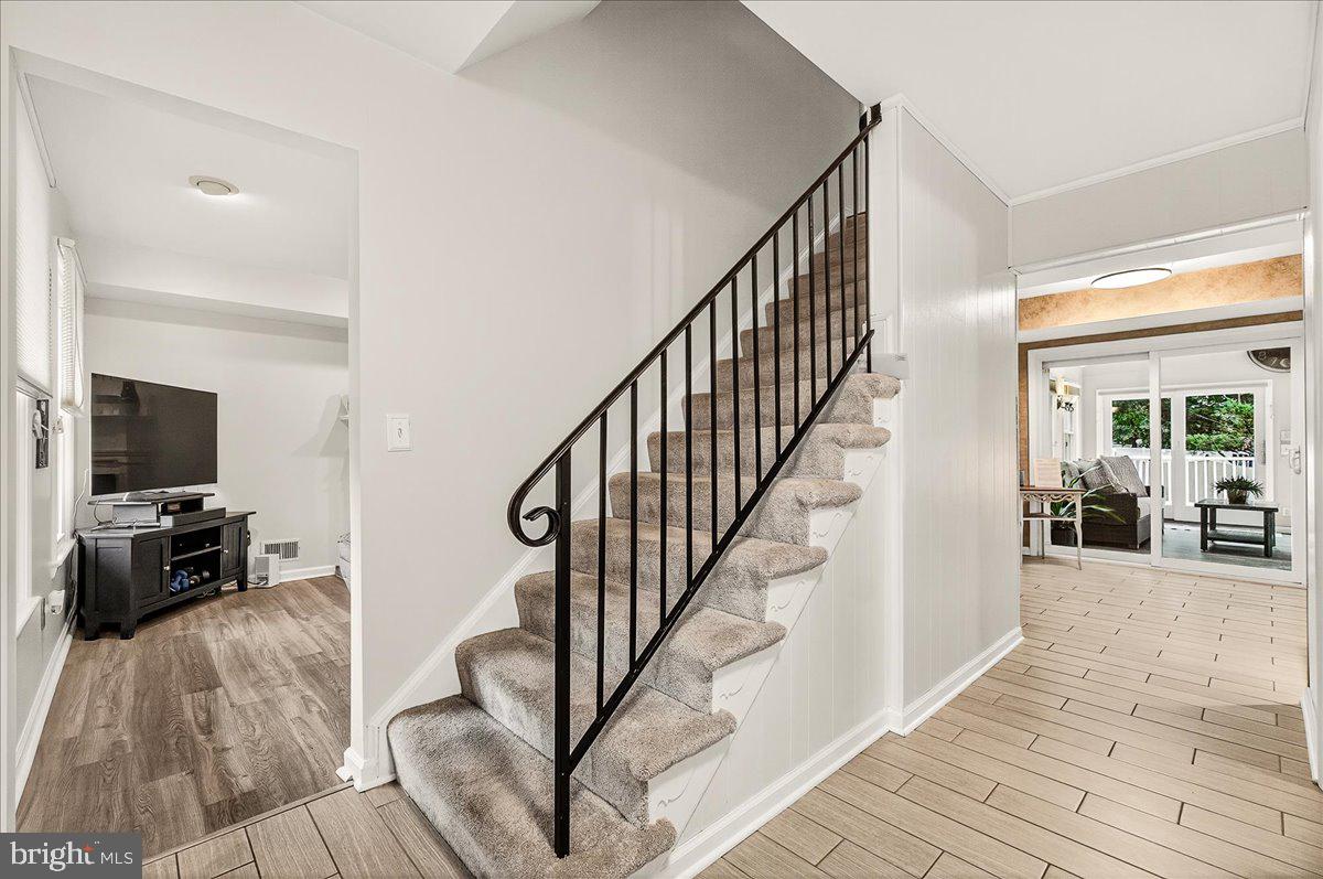 19624 Westerly Avenue Poolesville, MD 20837 - Photo 5 of 44 a view of a livingroom with furniture and a flat screen tv