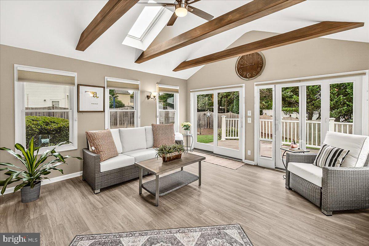 19624 Westerly Avenue Poolesville, MD 20837 - Photo 6 of 44 a living room with furniture and a large window