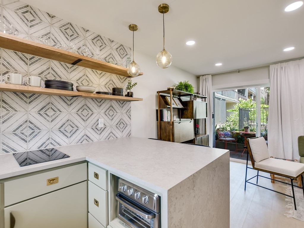 500 East Riverside Drive, Unit 169 Austin, TX 78704 - Photo 7 of 19 a kitchen with a cabinets and appliances