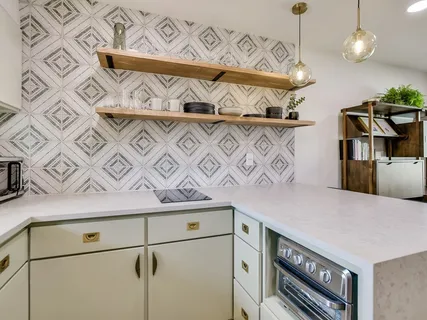 a kitchen with a table and chairs