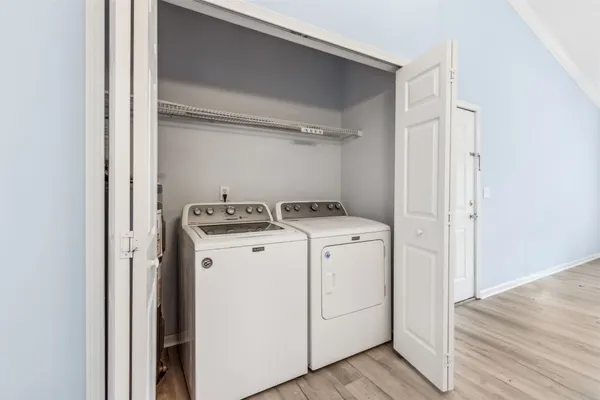 a view of storage and utility room with washer and dryer
