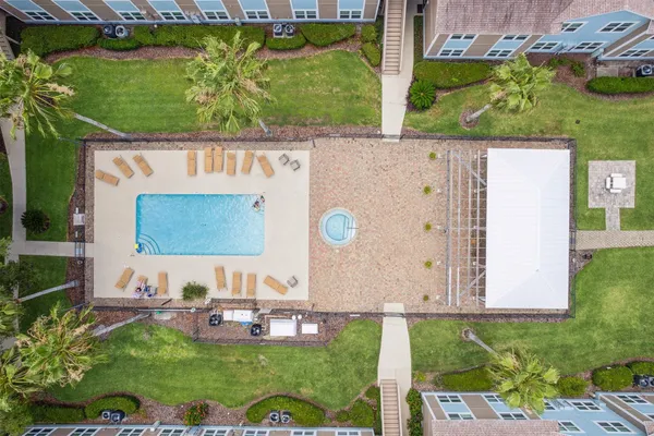 an aerial view of a house with a swimming pool