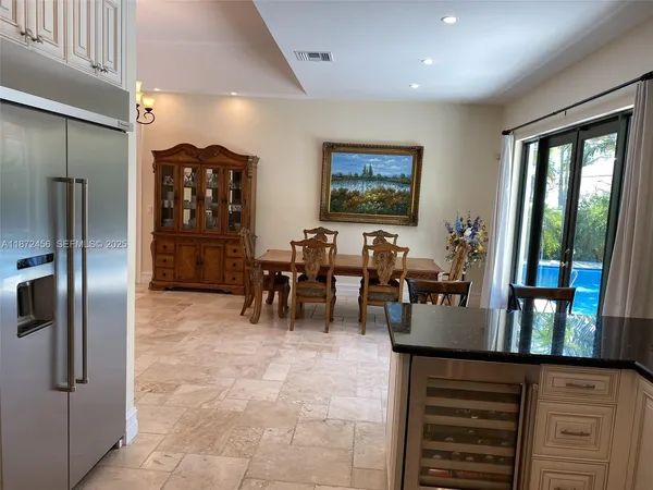 a group of chairs sitting in kitchen and dining room