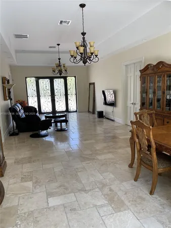 a view of a livingroom with furniture and a ceiling fan
