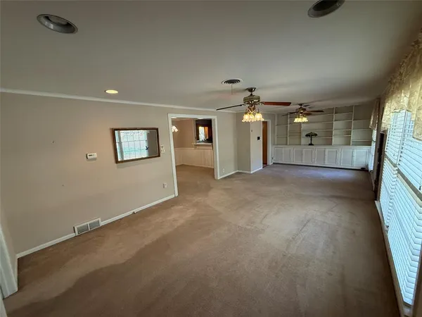 a view of a hallway with a livingroom