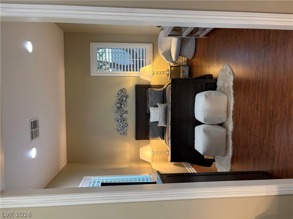 977 Rhyolite Terrace Henderson, NV 89011 - Photo 20 of 33 Warm hardwood floors and recessed lighting enhance this peaceful, private retreat.