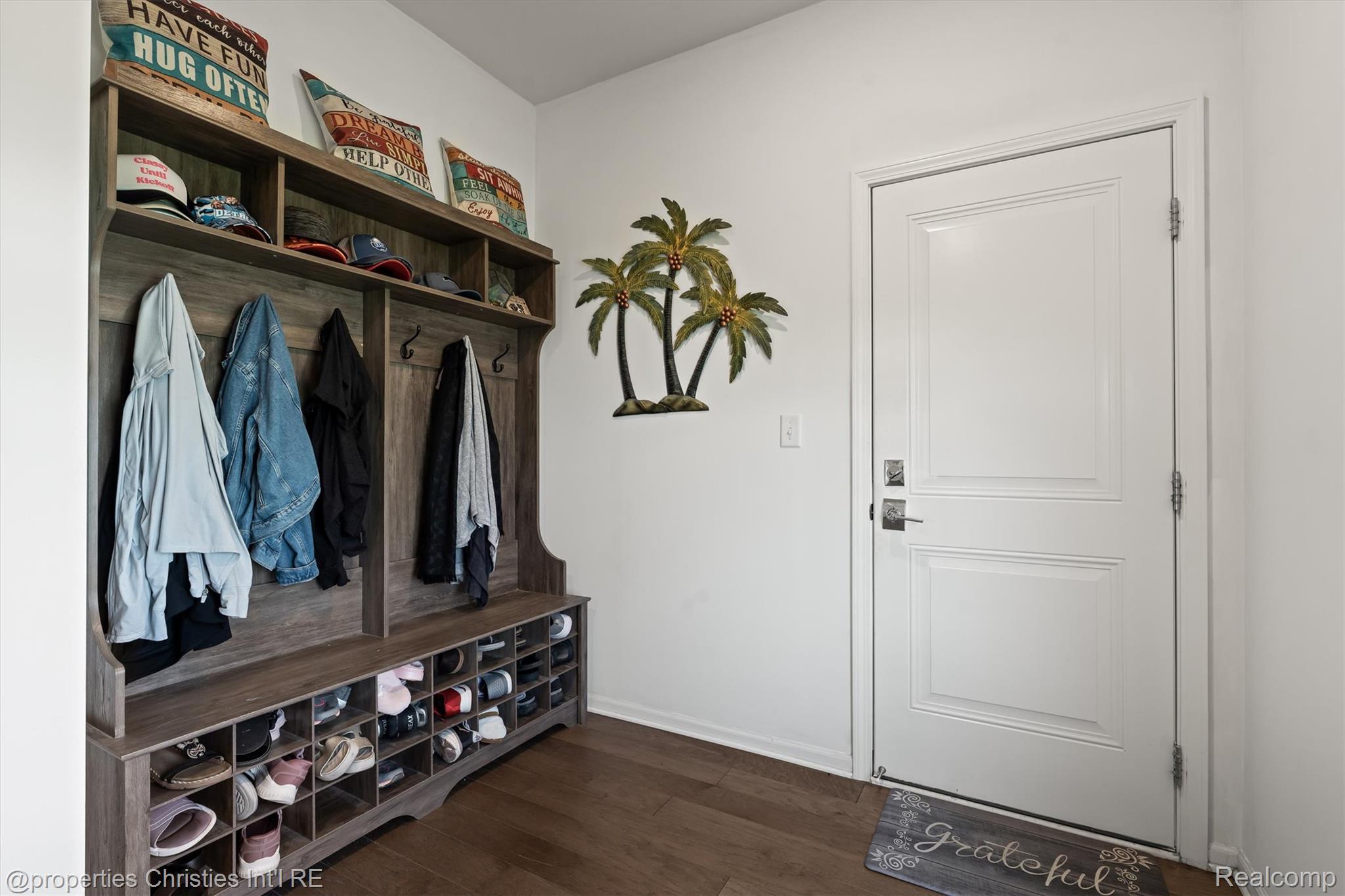 2721 Maize Loop Saline, MI 48176 - Photo 30 of 52 Mudroom featuring dark wood-style floors and baseboards