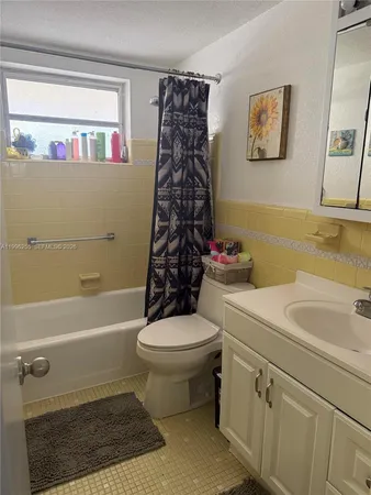a bathroom with a sink a toilet and a bathtub