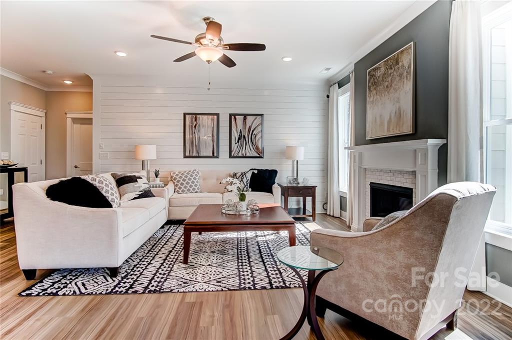 1006 Baldwin Drive Lancaster, SC 29720 - Photo 12 of 48 a living room with furniture a flat screen tv and a fireplace