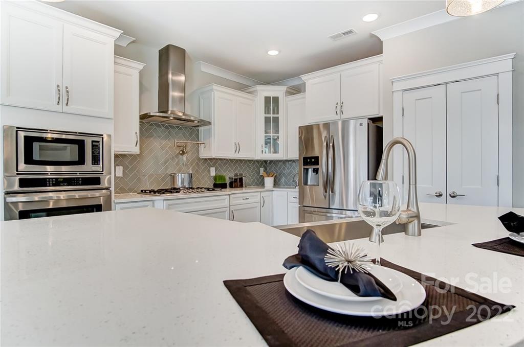 1006 Baldwin Drive Lancaster, SC 29720 - Photo 20 of 48 a kitchen with stainless steel appliances a sink and a refrigerator