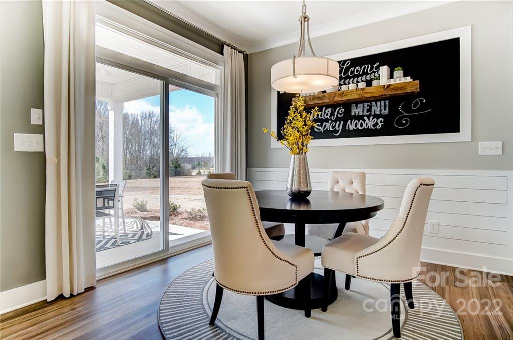 1006 Baldwin Drive Lancaster, SC 29720 - Photo 23 of 48 a view of a dining room with furniture wooden floor and a chandelier