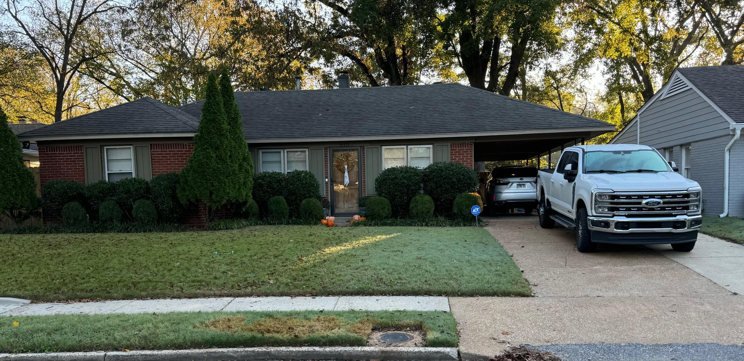 a car parked in front of a house