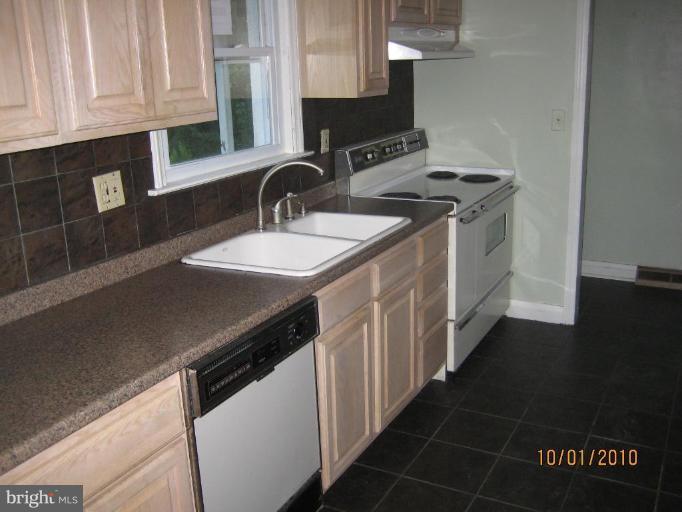 612 Reckord Road Fallston, MD 21047 - Photo 2 of 8 a kitchen with stainless steel appliances a sink stove and cabinets