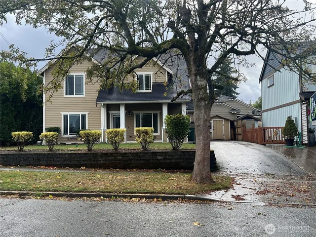 a front view of a house with a yard