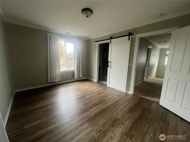 a view of entryway with wooden floor