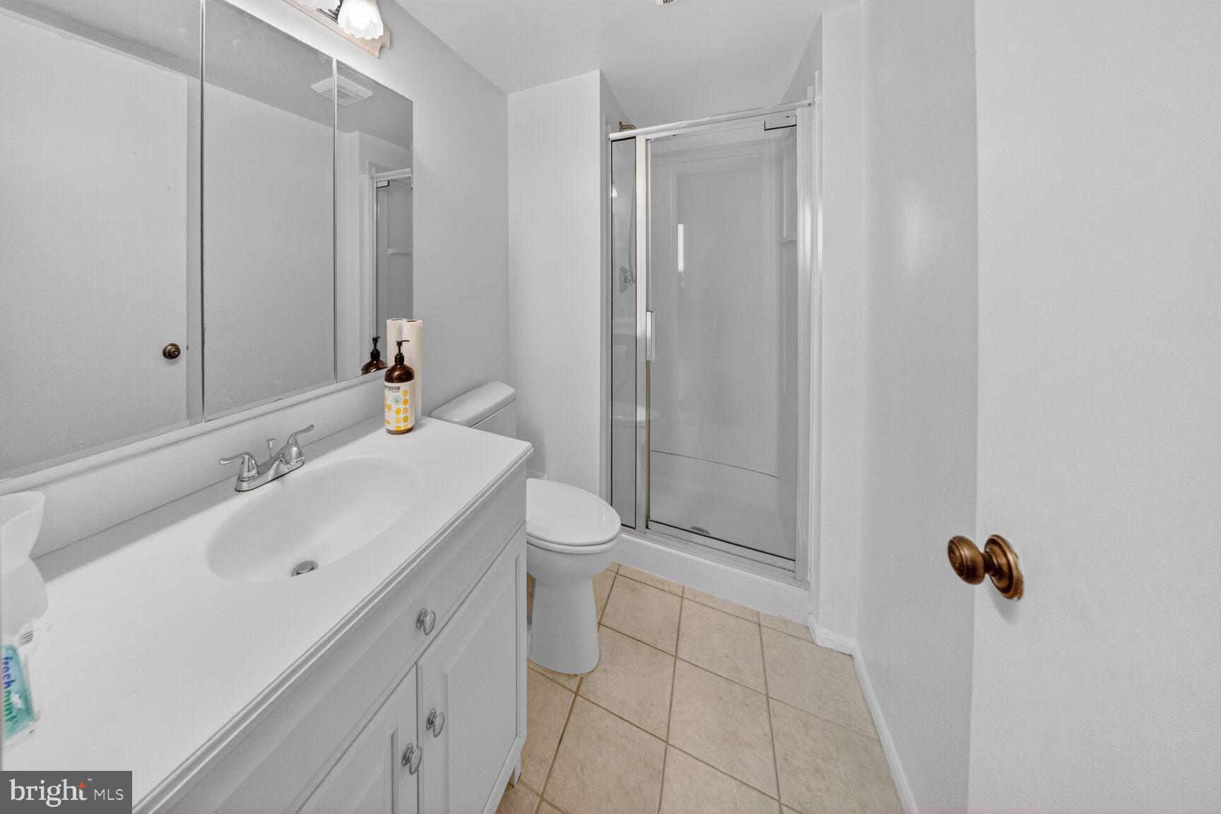 15115 Interlachen Drive, Unit 3812 Silver Spring, MD 20906 - Photo 20 of 46 a bathroom with a sink toilet and shower