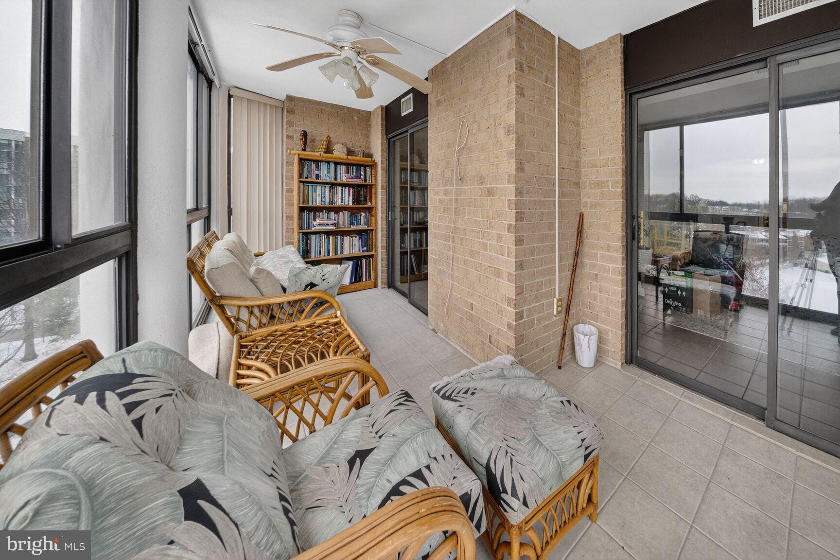 15115 Interlachen Drive, Unit 3812 Silver Spring, MD 20906 - Photo 31 of 46 a bedroom with furniture and a book shelf