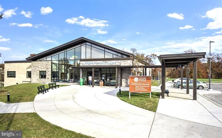 15115 Interlachen Drive, Unit 3812 Silver Spring, MD 20906 - Photo 35 of 46 a front view of a house with a yard