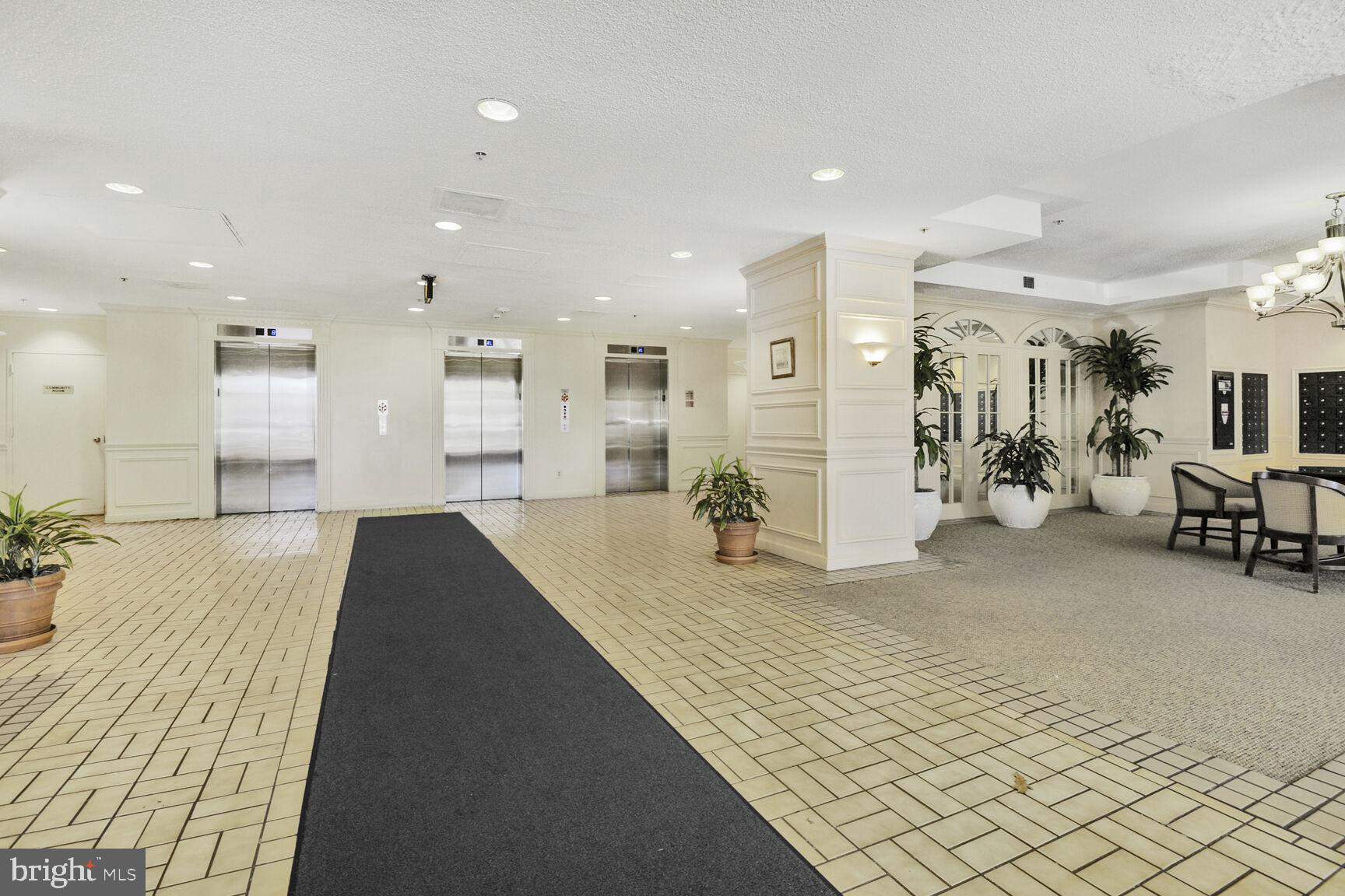 15115 Interlachen Drive, Unit 3812 Silver Spring, MD 20906 - Photo 4 of 46 a view of a kitchen with kitchen island granite countertop lots of counter top space