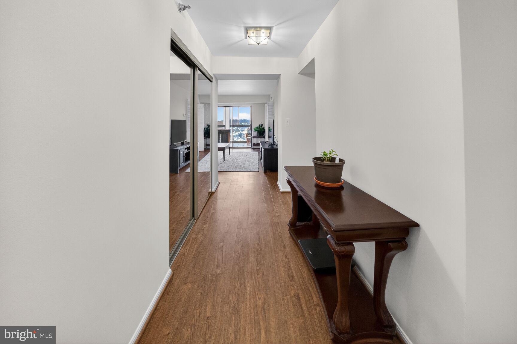 15115 Interlachen Drive, Unit 3812 Silver Spring, MD 20906 - Photo 6 of 46 a view of a living room with furniture and wooden floor
