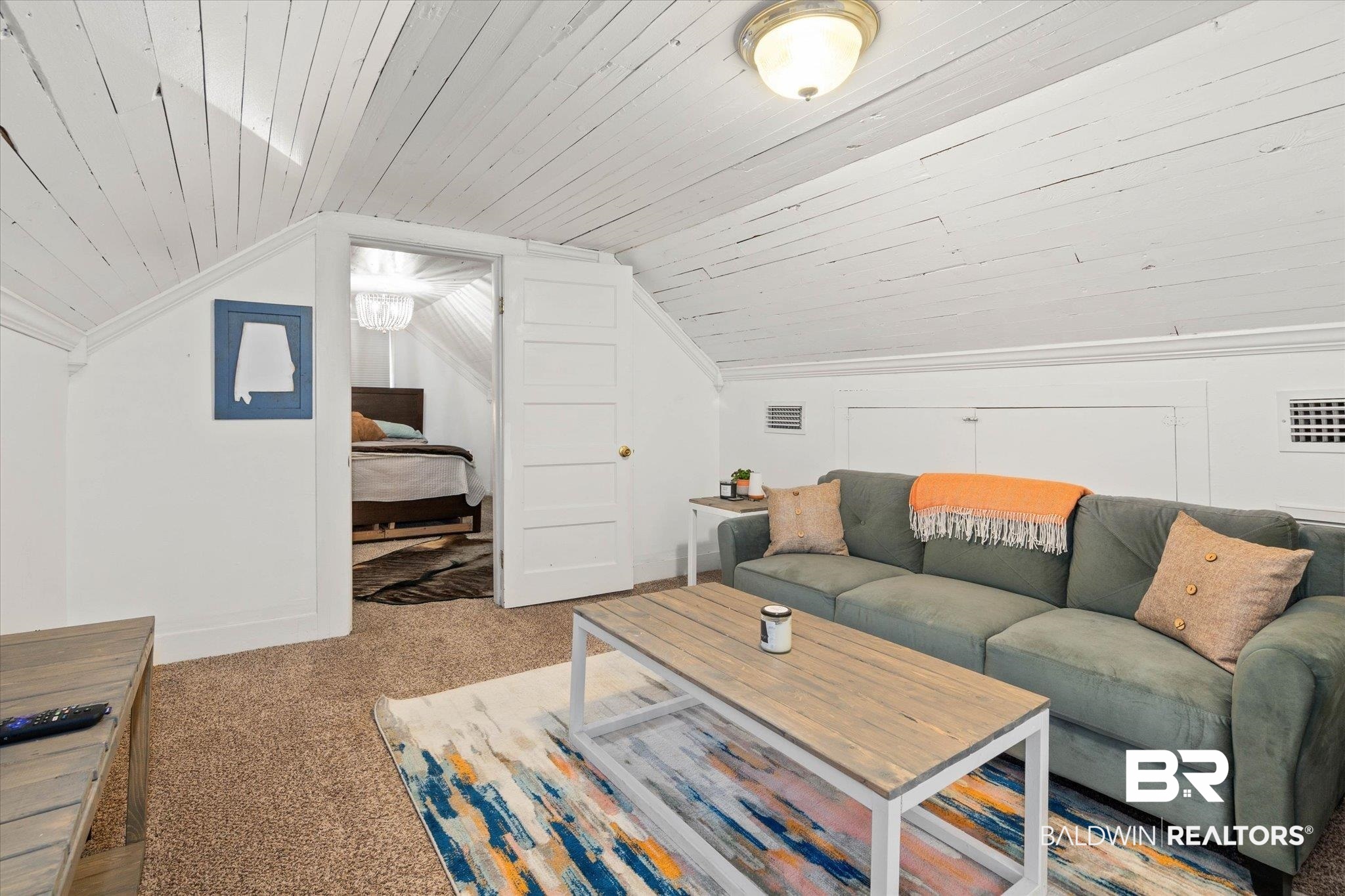 20 Hurlbert Street Mobile, AL 36607 - Photo 18 of 33 Living area featuring carpet flooring and lofted ceiling