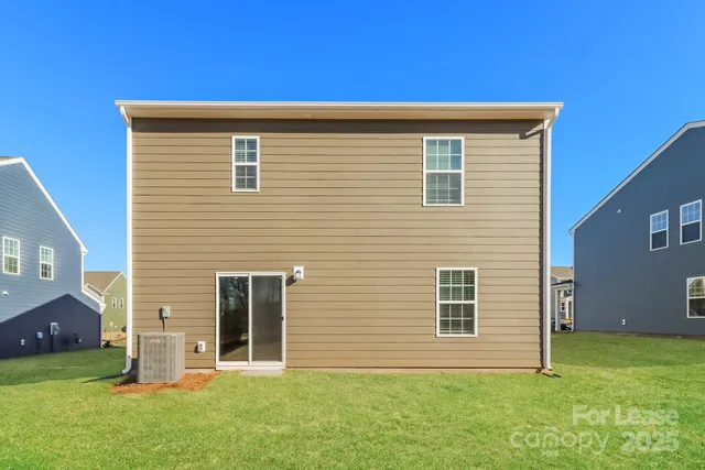 a view of backyard with garage
