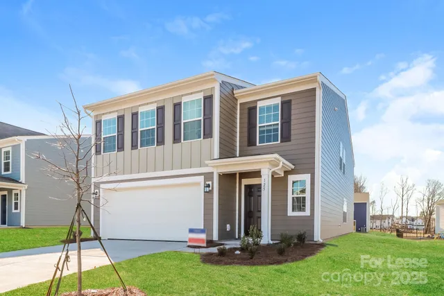 a kitchen with stainless steel appliances a refrigerator and a stove top oven