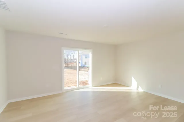 a kitchen with kitchen island a sink appliances and cabinets