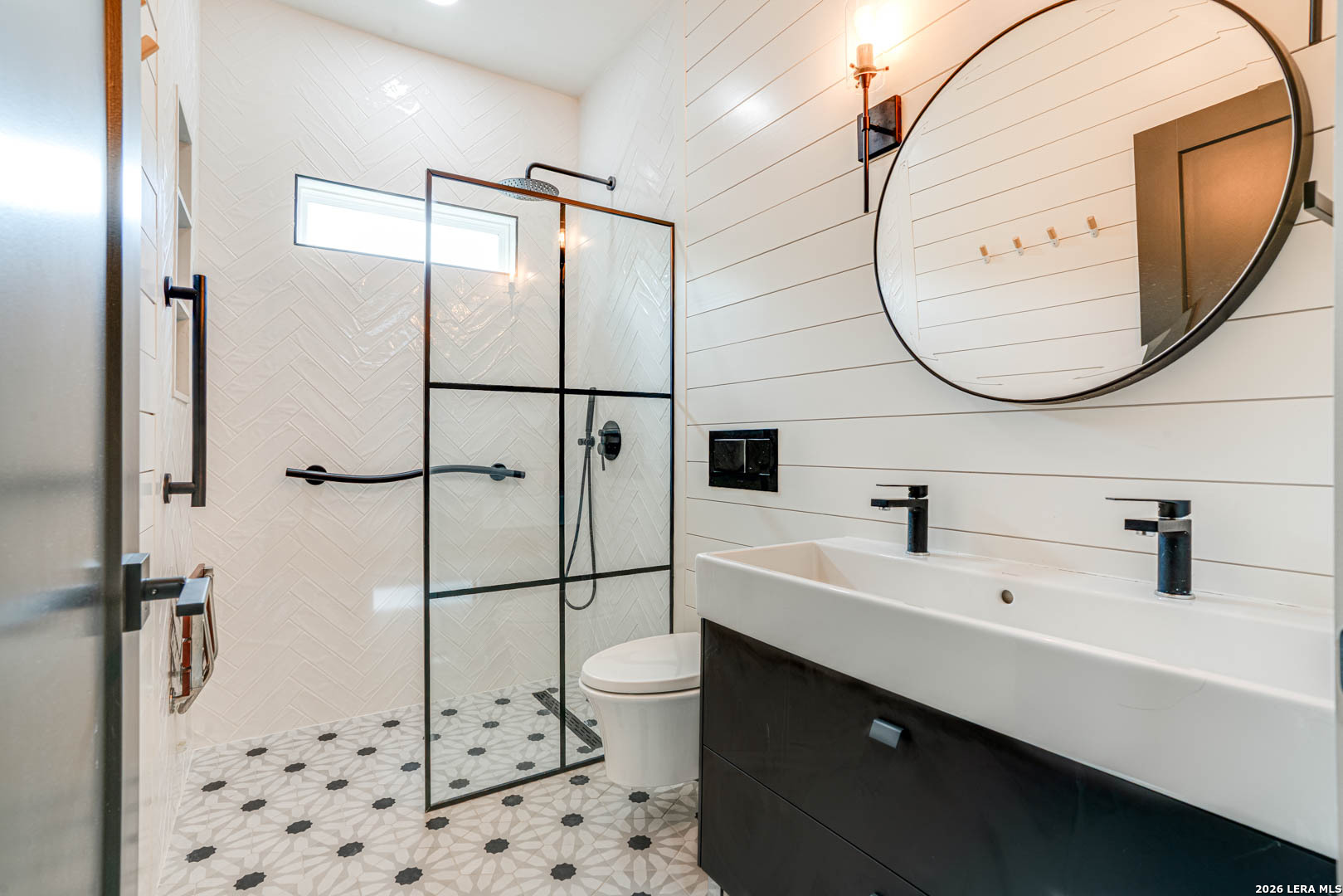 316 Prairie Tea Lane Spring Branch, TX 78070 - Photo 4 of 38 a bathroom with a sink a toilet and a mirror