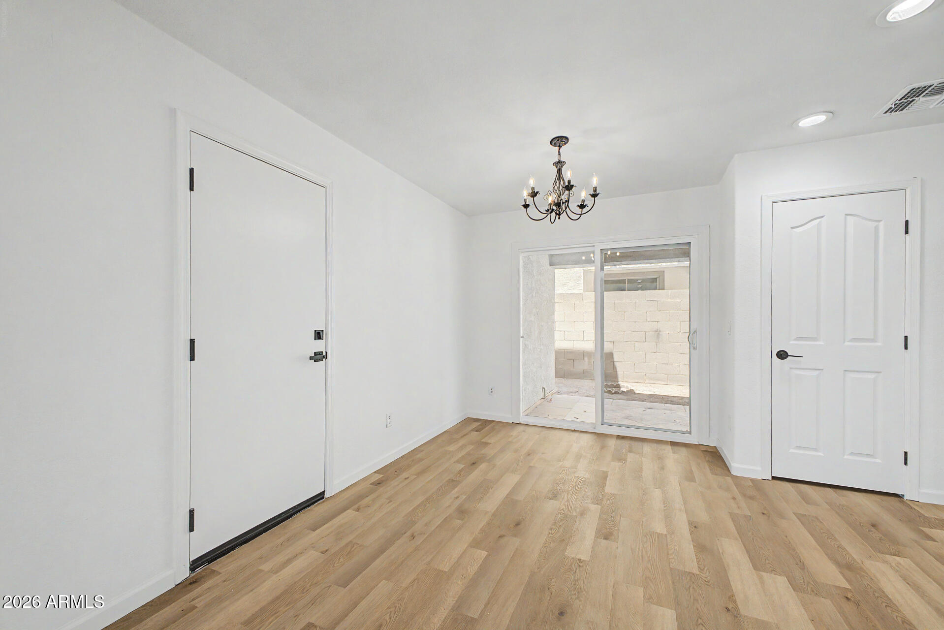 6452 West Ruth Avenue Glendale, AZ 85302 - Photo 11 of 35 wooden floor in an empty room with a window