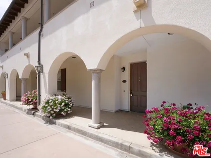 a front view of a house with flowers