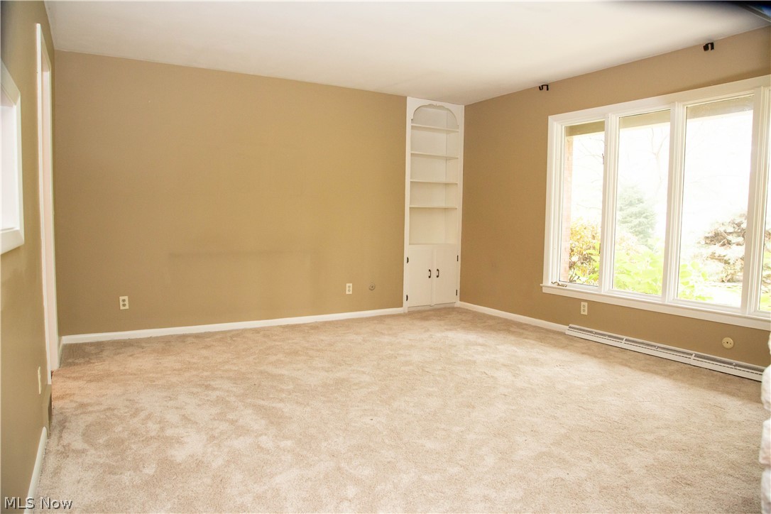 121 South Tamarack Road Akron, OH 44319 - Photo 15 of 35 Living Room with built-in cabinet and bookshelf