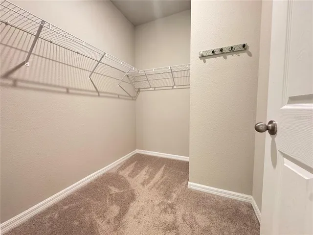 a bathroom with a glass door shower