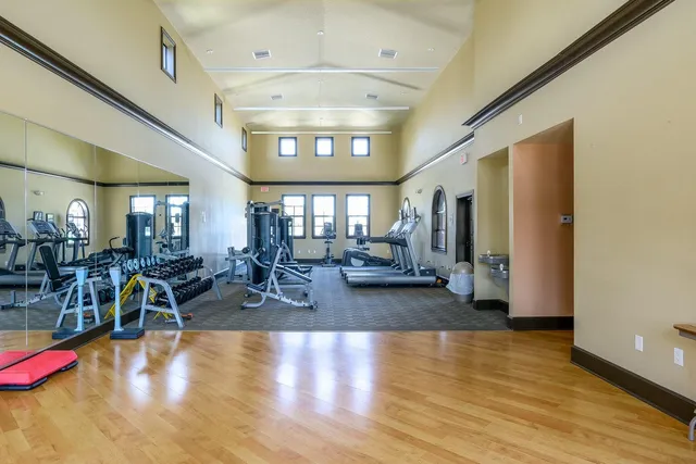 a view of balcony with wooden floor and fence