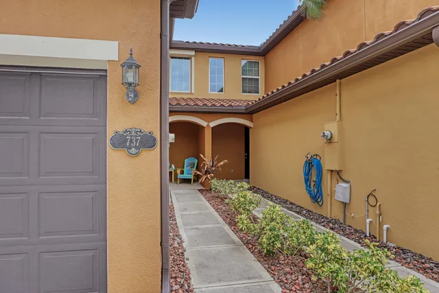 a front view of a house with many windows