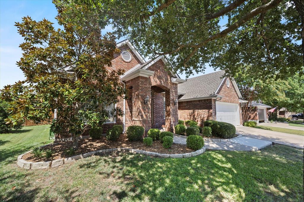 207 Leonard Way Fate, TX 75087 - Photo 29 of 31 front view of a house with a yard