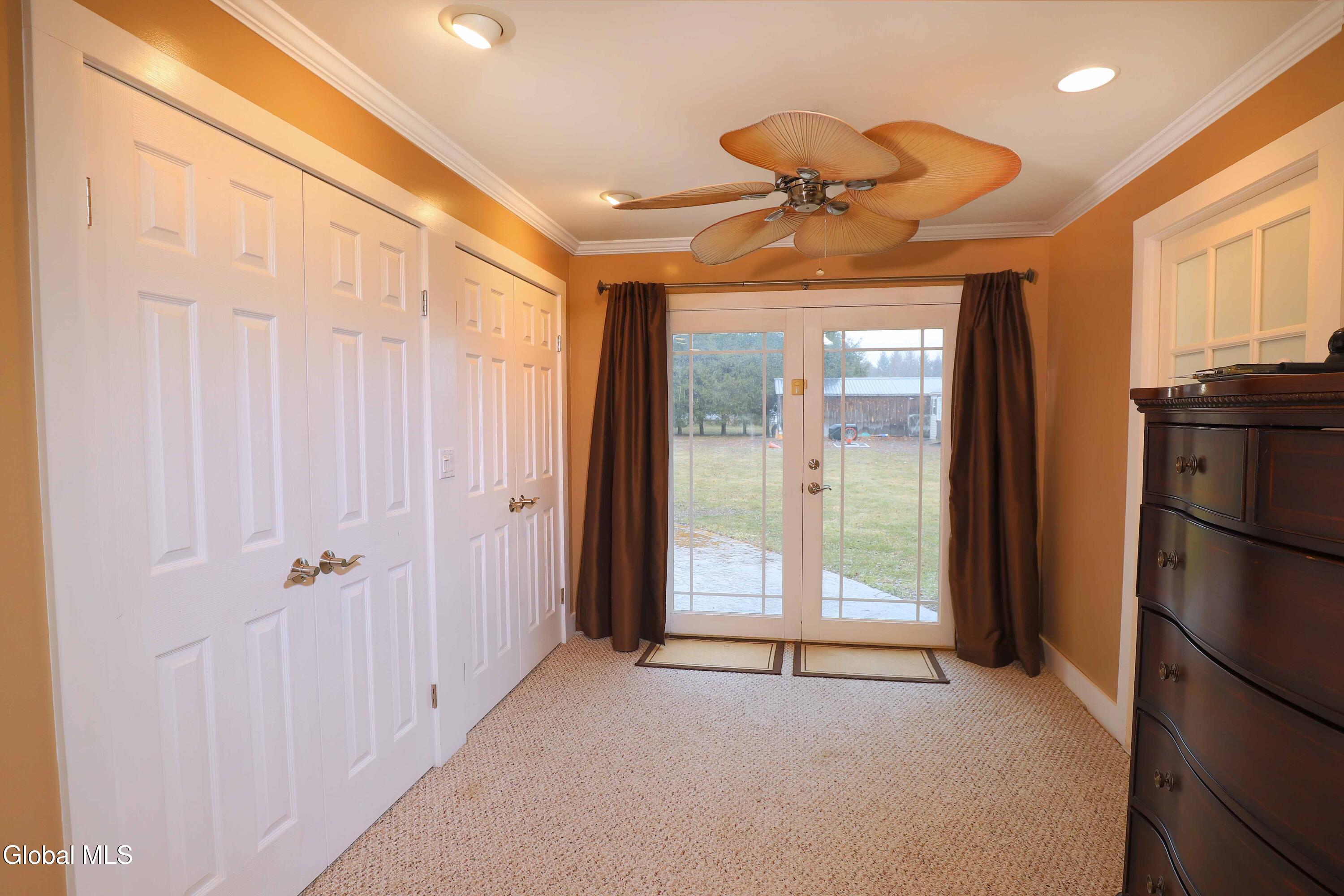 2387 Hickory Hill Road Fonda, NY 12068 - Photo 15 of 36 Primary bedroom closet and door to patio