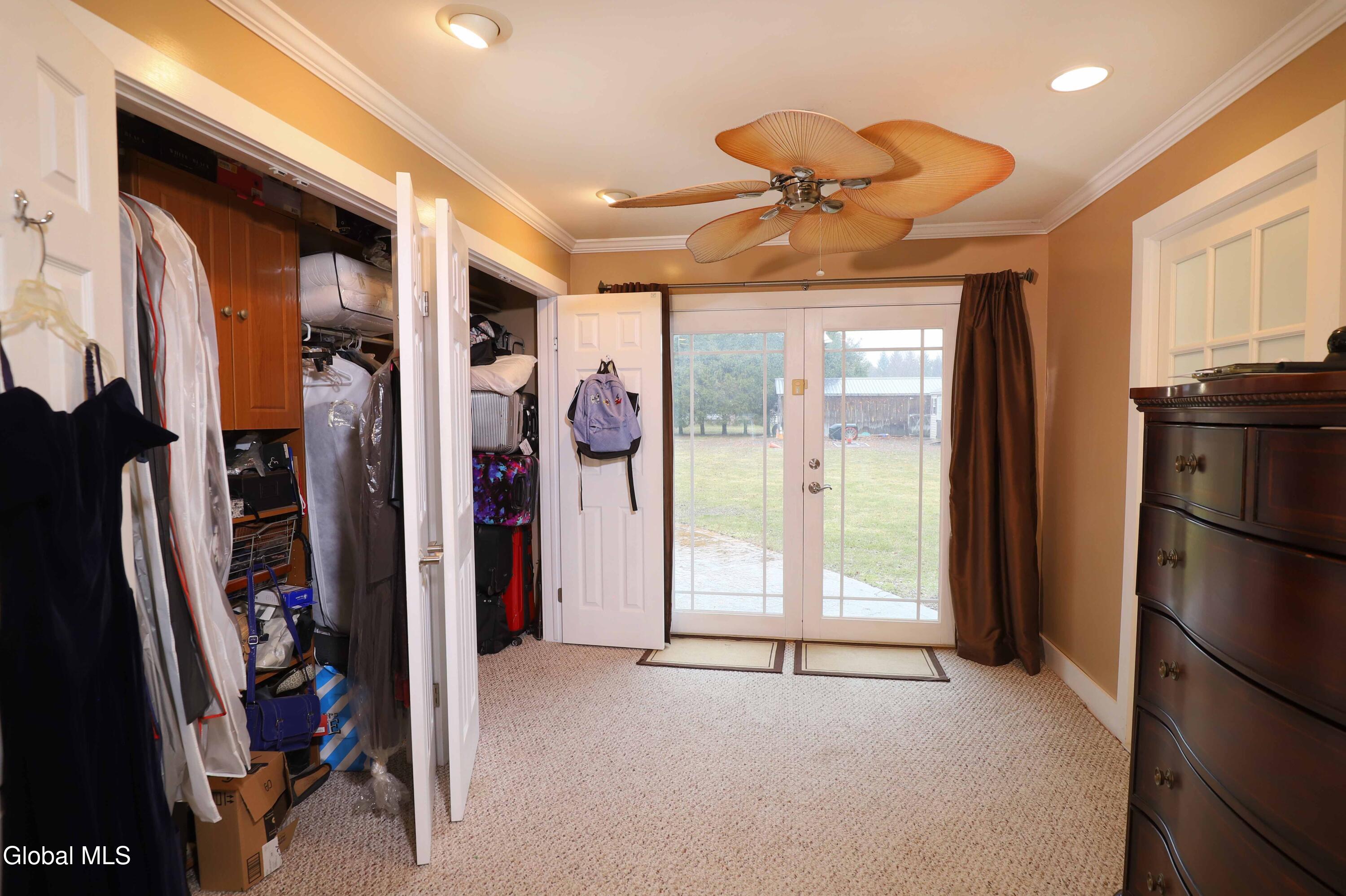 2387 Hickory Hill Road Fonda, NY 12068 - Photo 16 of 36 Primary Bedroom closet and doors to pati
