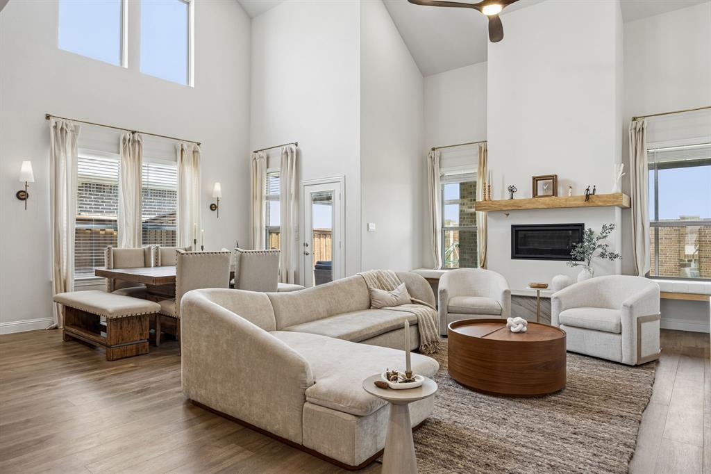 425 Breeds Hl Road Little Elm, TX 75068 - Photo 9 of 38 a living room with furniture and a fireplace
