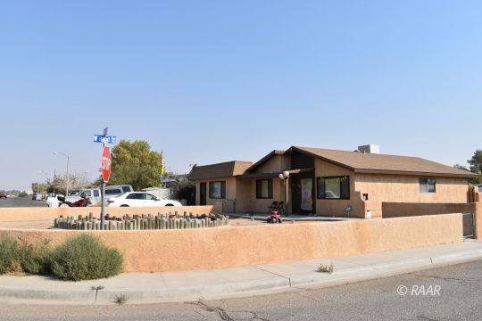 424 South Gordon Street Ridgecrest, CA 93555 - Photo 6 of 6 a front view of a house with a garden