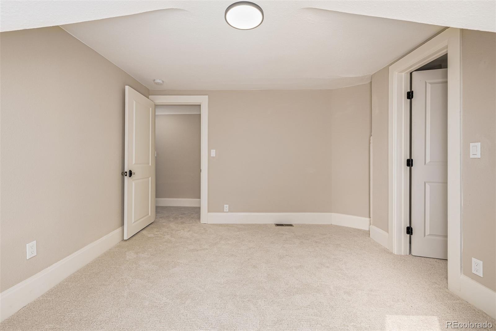 3854 Cook Street Denver, CO 80205 - Photo 22 of 42 an empty room with closet area