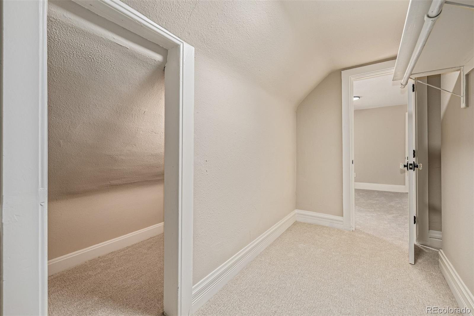 3854 Cook Street Denver, CO 80205 - Photo 26 of 42 a bathroom with a glass shower door