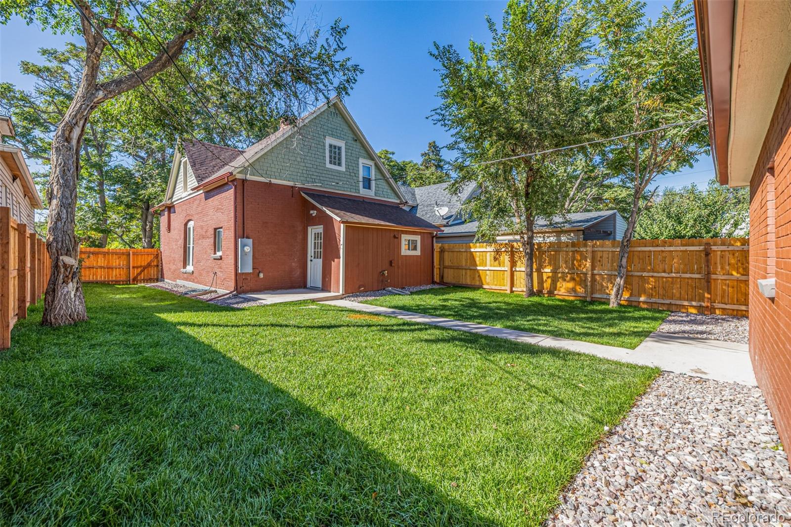 3854 Cook Street Denver, CO 80205 - Photo 32 of 42 a view of a house with a yard