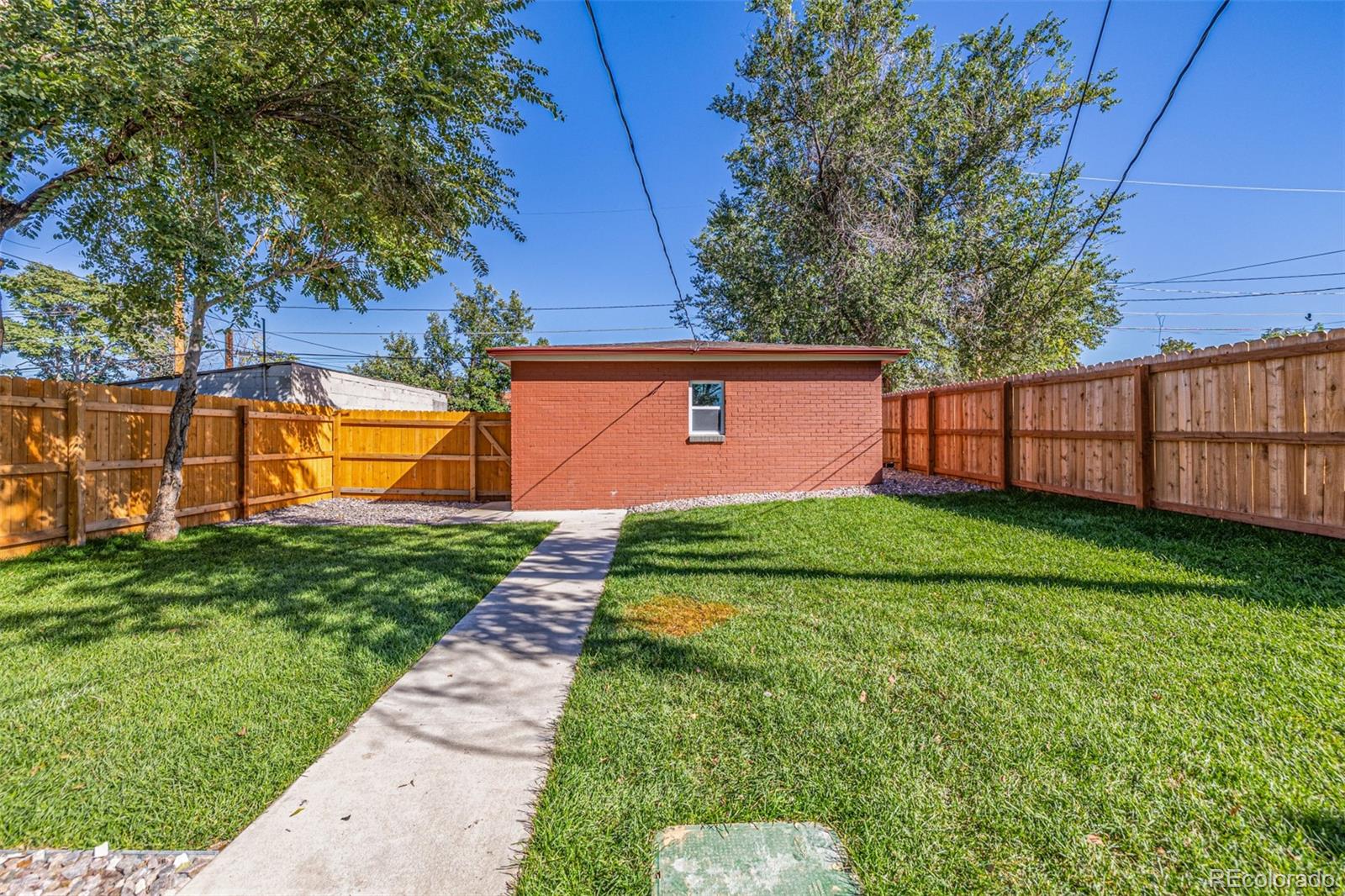3854 Cook Street Denver, CO 80205 - Photo 35 of 42 a view of a backyard with a garden
